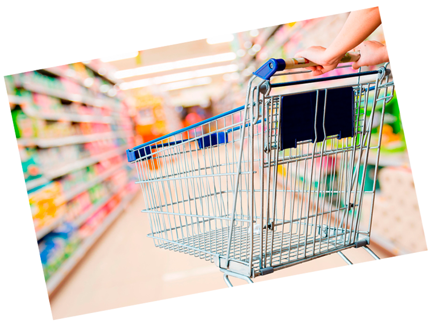 a person is pushing a shopping cart in a supermarket .