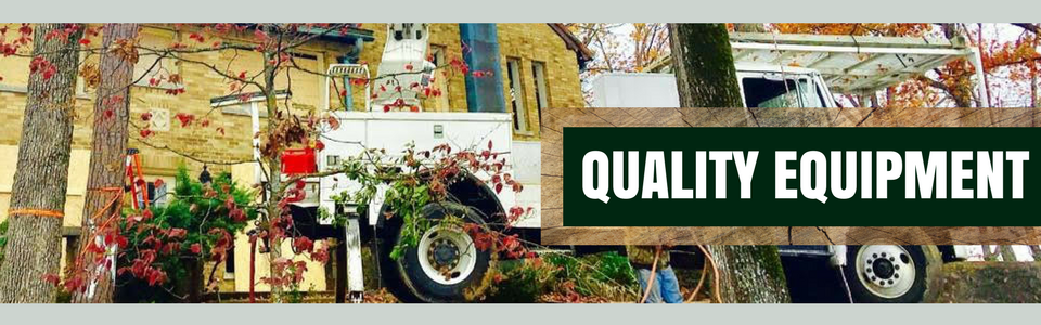 Truck with “QUALITY EQUIPMENT” sign in a colorful, industrial outdoor setting