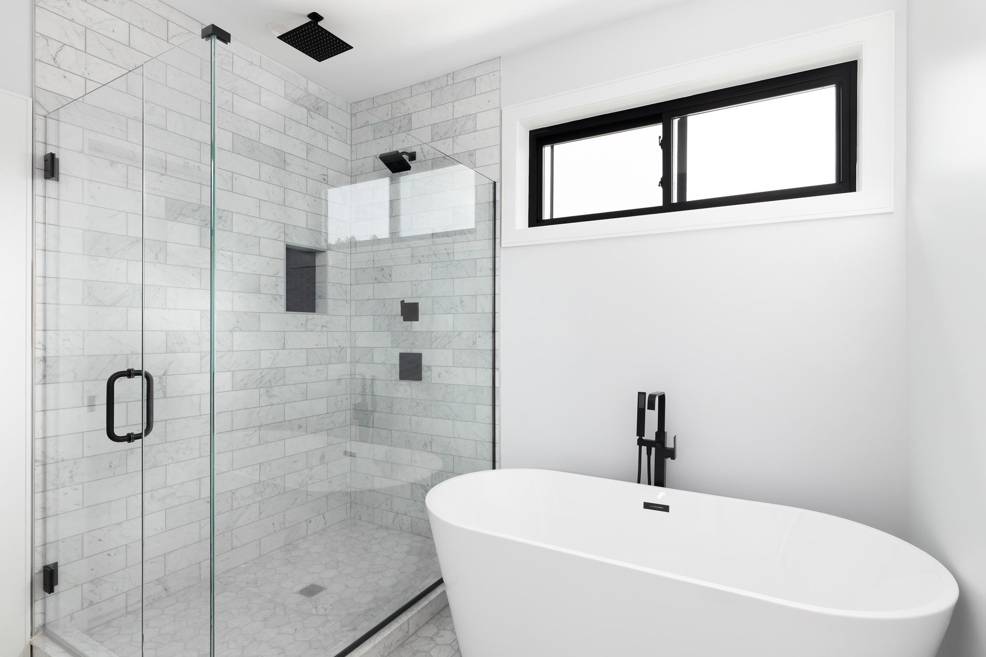 Modern marble bathroom design, representing high quality shower door installation. Modern marble bathroom design, representing high quality shower door installation.