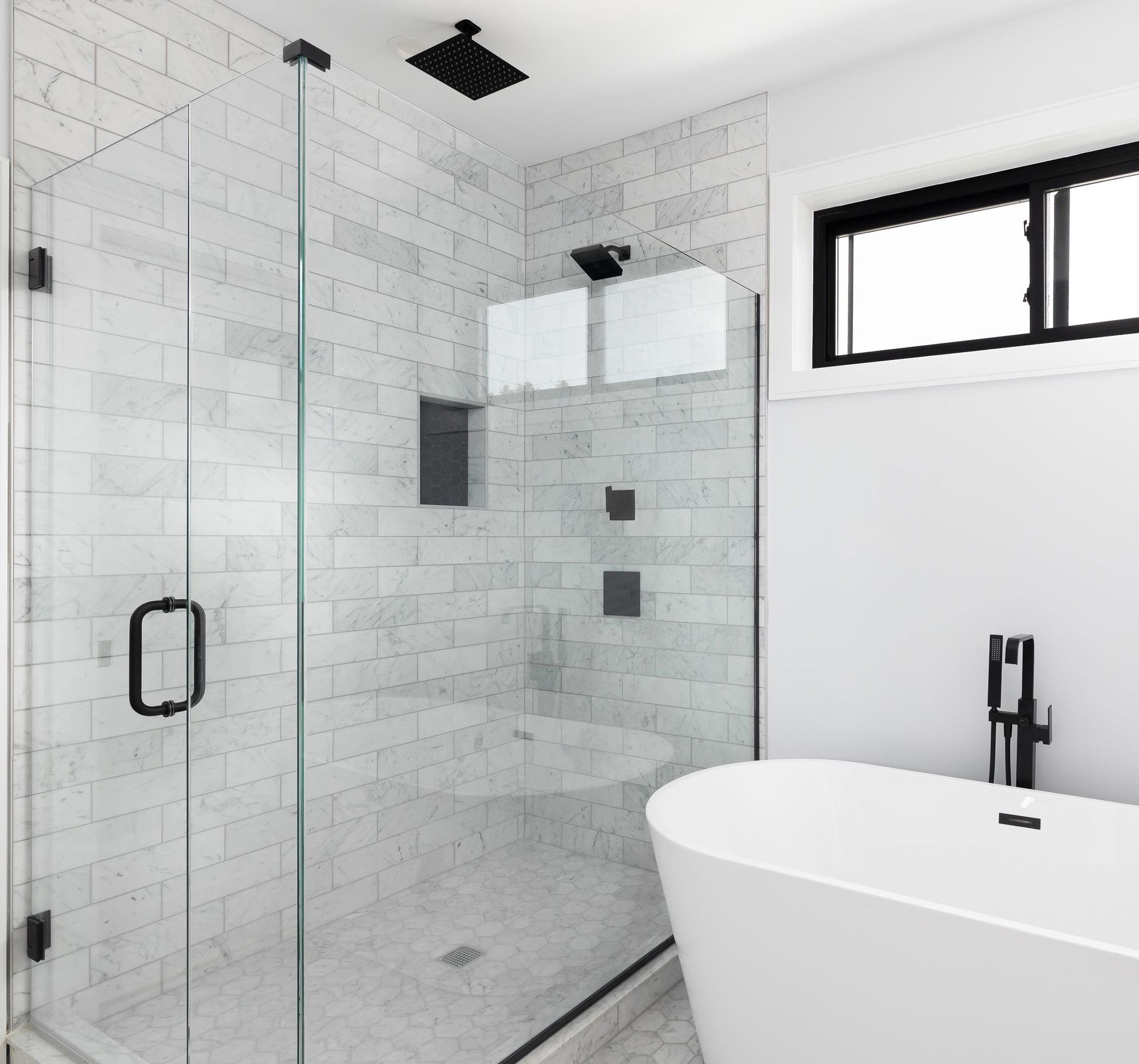 luxury shower and freestanding bathtub with glass surrounding the shower. luxury shower and freestanding bathtub with glass surrounding the shower.