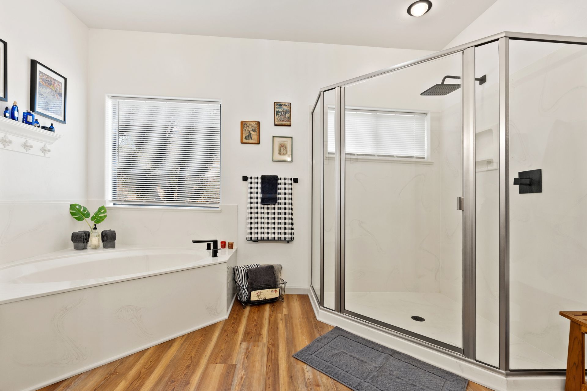 Modern bathroom with frameless shower doors and a large corner glass shower enclosure. Modern bathroom with frameless shower doors and a large corner glass shower enclosure.