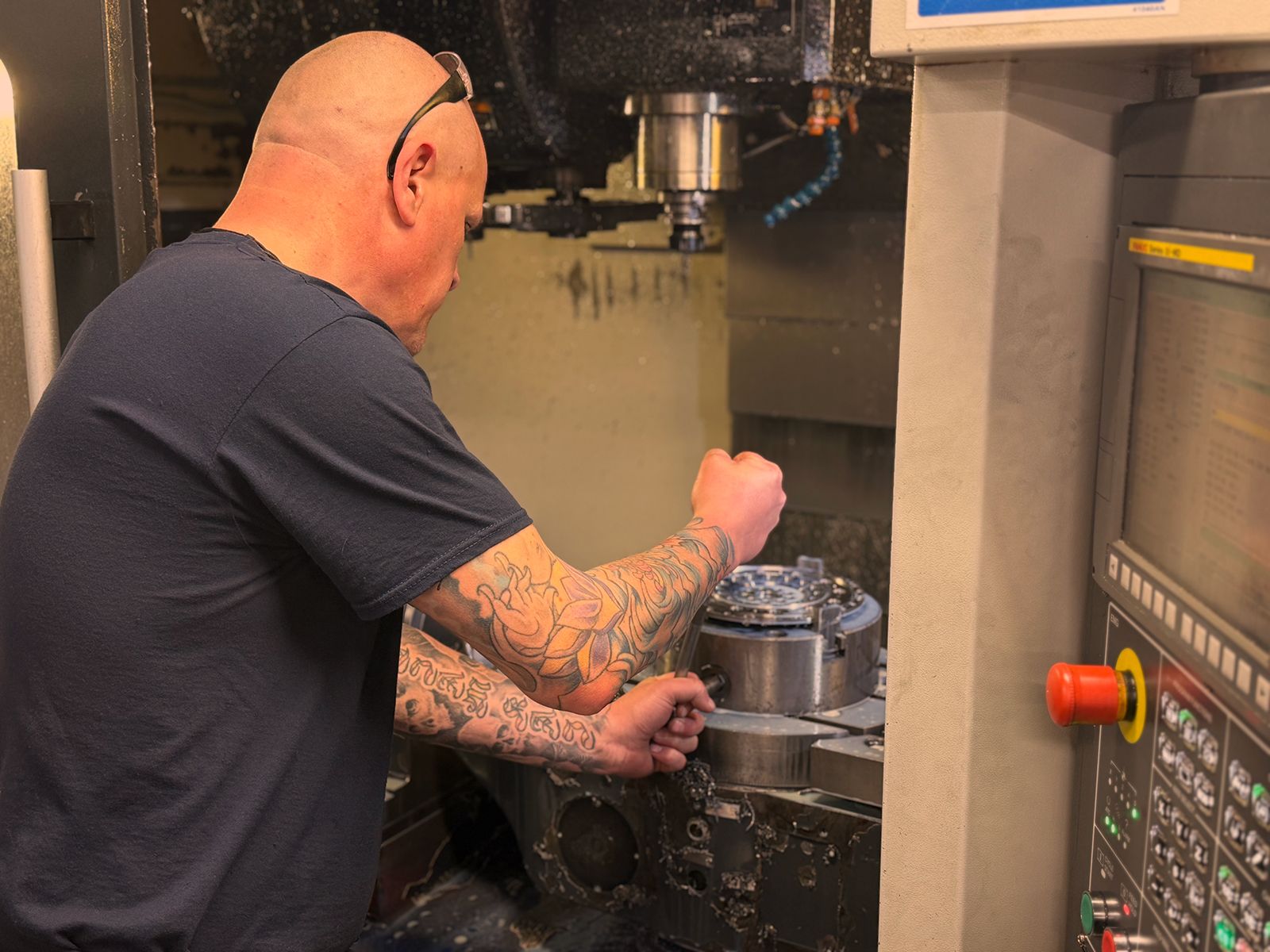 Man working on milling machine