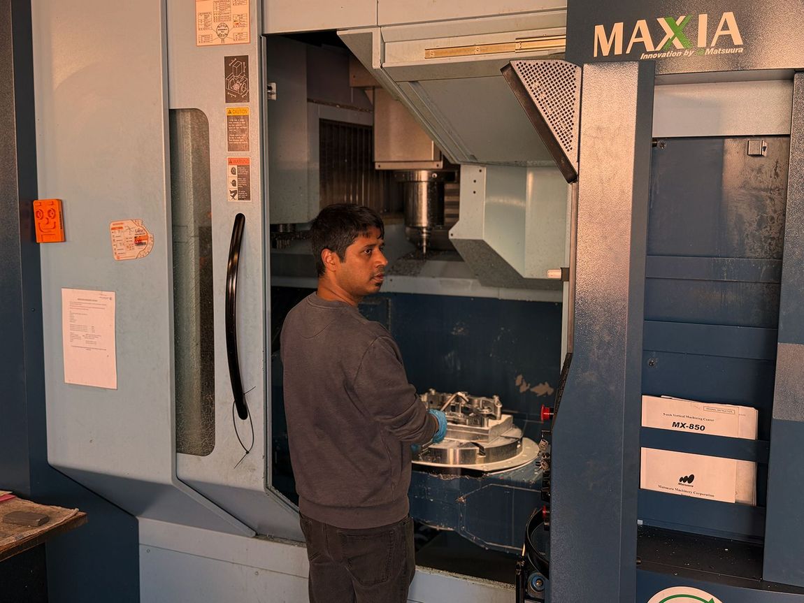 Man working on CNC machine