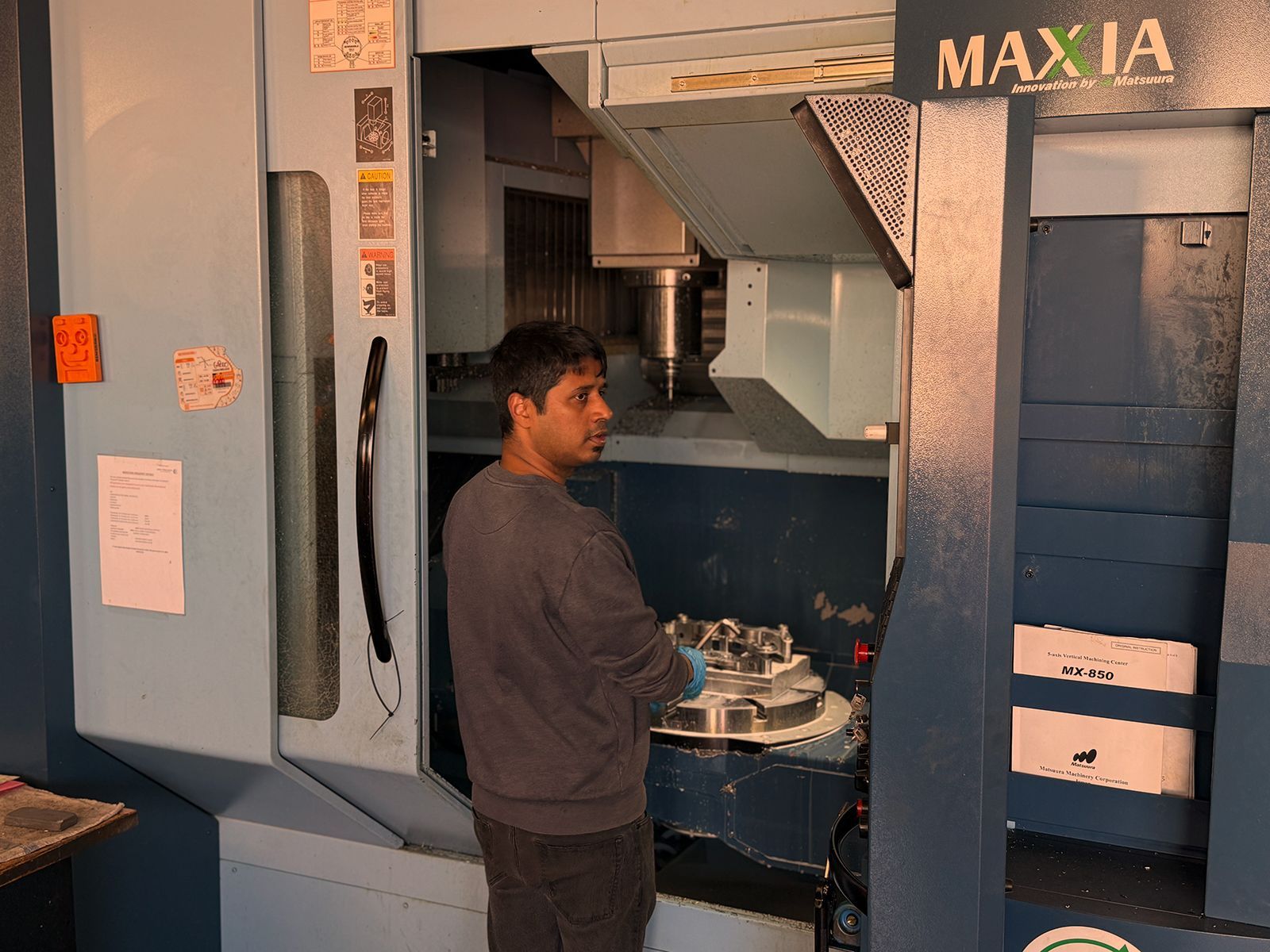 Man working on CNC machine