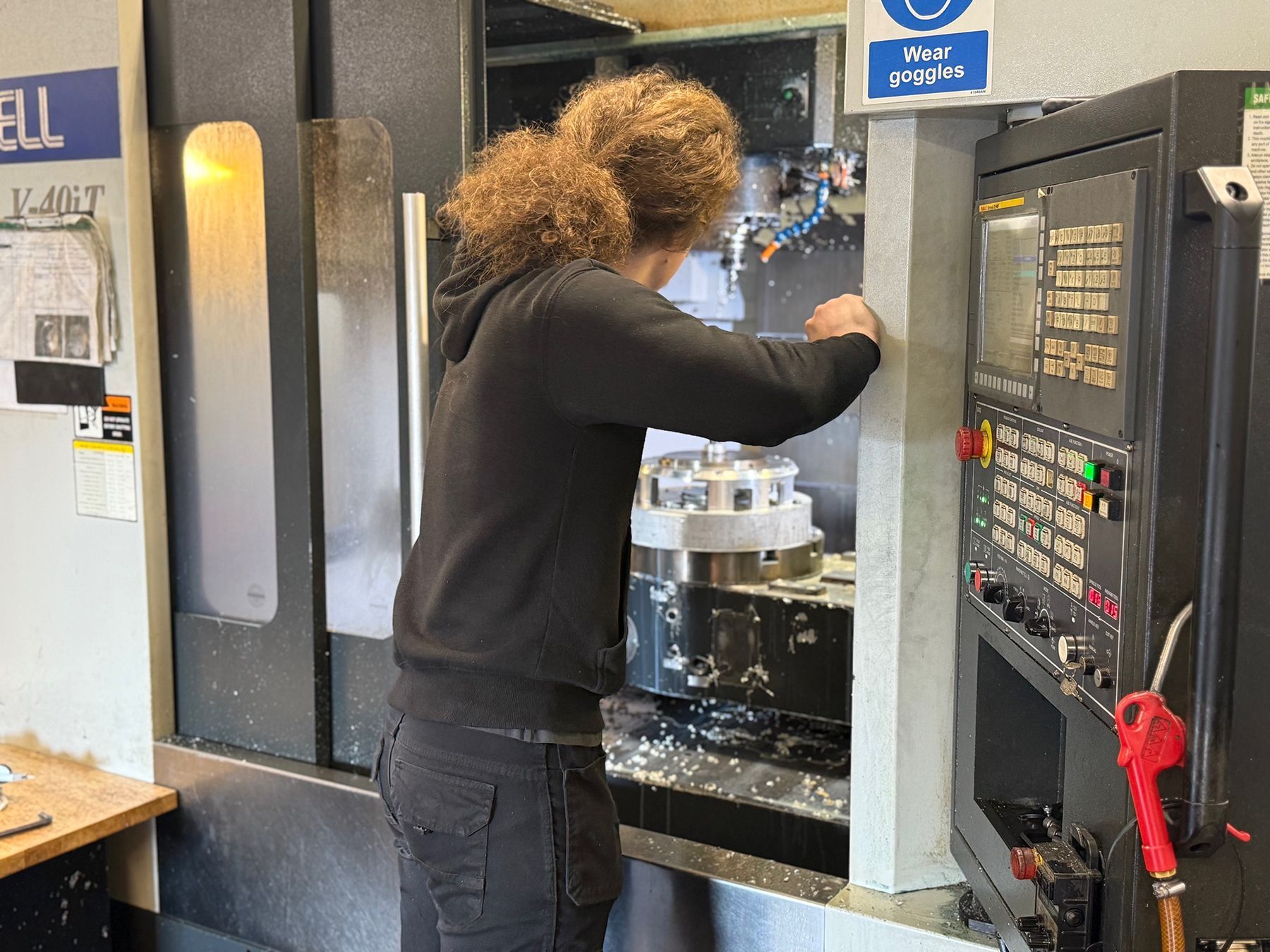 man working at cnc machine