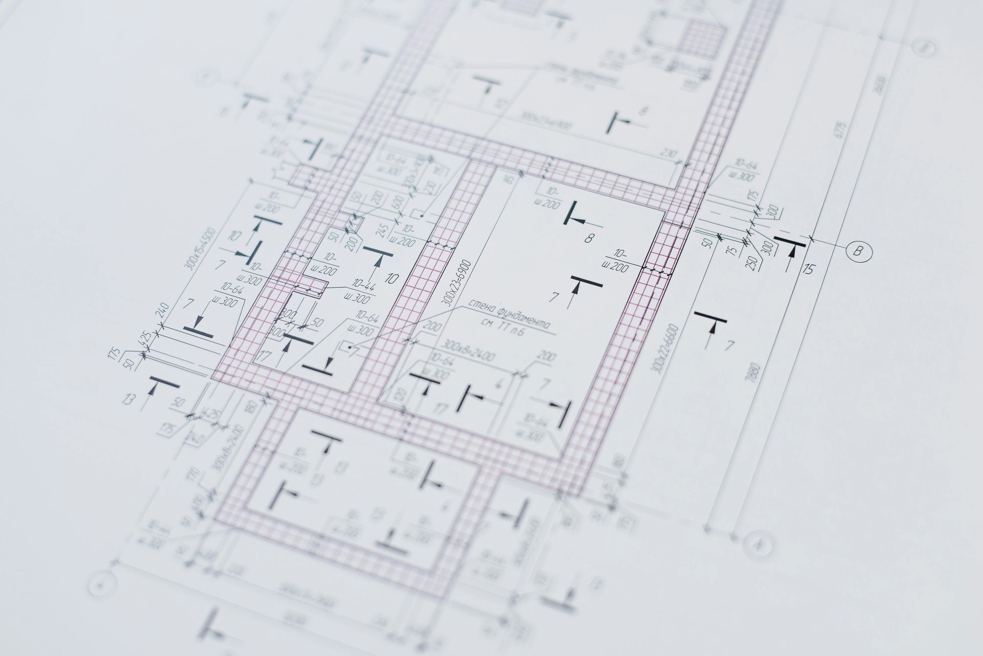 Architectural blueprint, showing detailed room layouts, lines, and symbols in black and purple on a white background.
