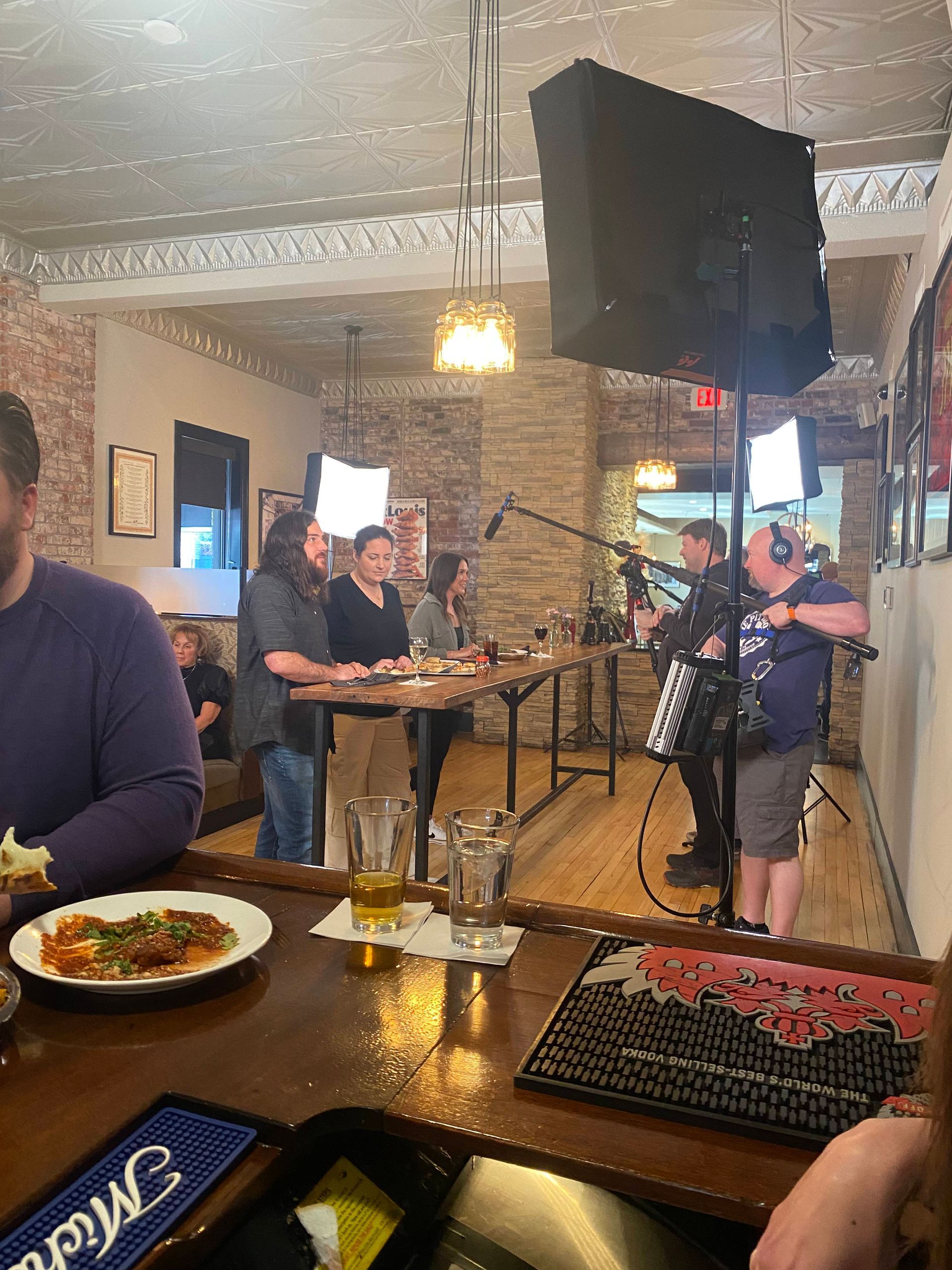 Live jazz band performing in a cozy restaurant with tables and diners nearby