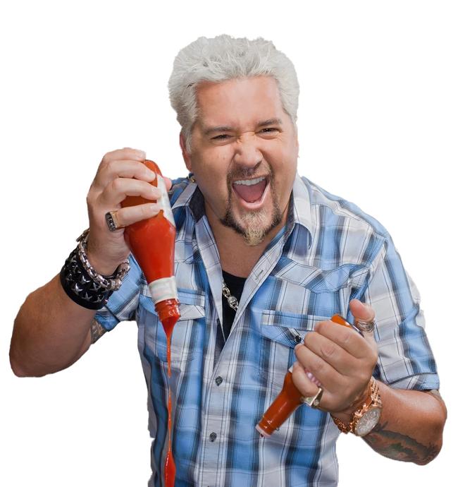Smiling man with gray hair holding two red chili peppers, one near his mouth, against a white background