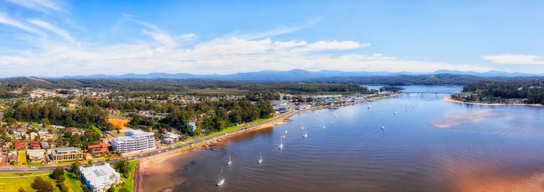 An Aerial View of a Ocean, Large Trees and Houses — Queanbeyan Auto Parts in Batemans Bay, NSW