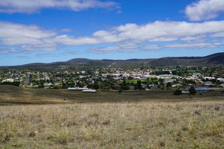 A View of a City From a Hill With Mountains — Queanbeyan Auto Parts in Cooma, NSW