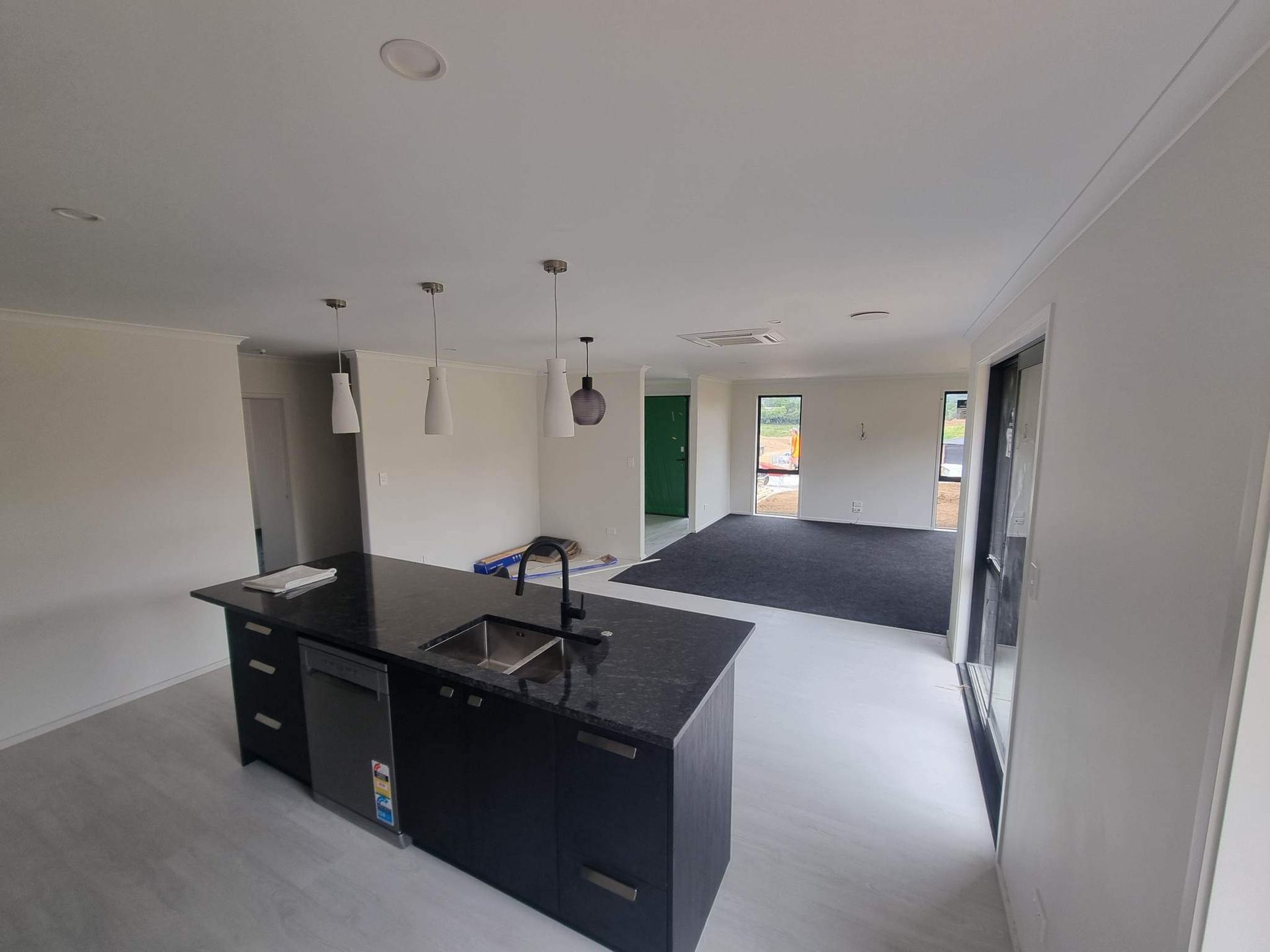 A kitchen with a large island in the middle of the room.