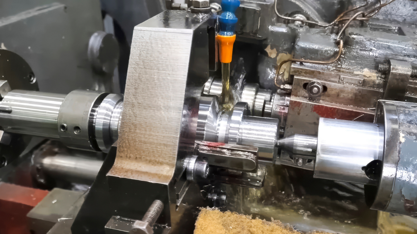 A large, densely packed bale of shredded white paper sits inside a metal frame on a factory floor.