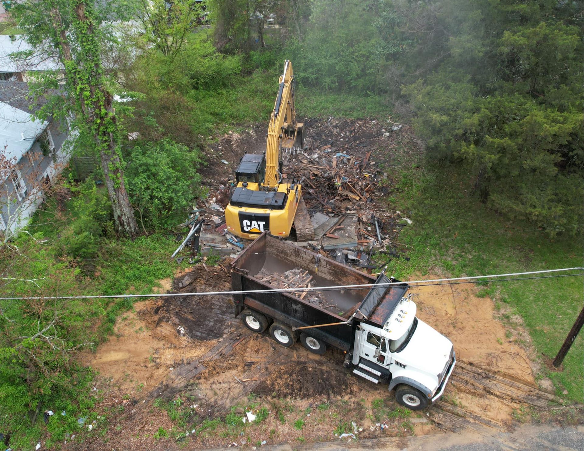 Two demolition excavators at work on an old train viaduct – Meridian, MS - Cullum Construction