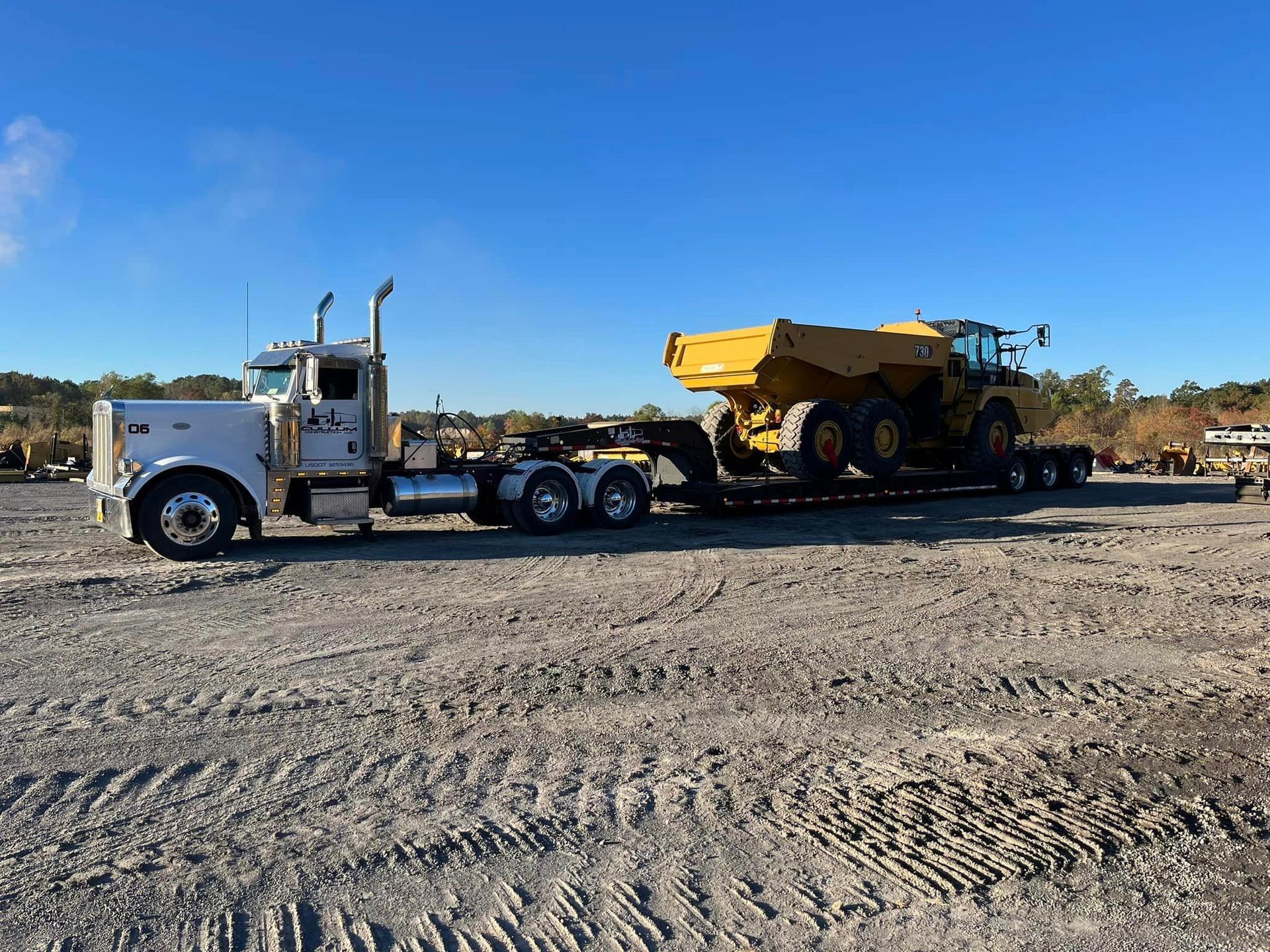 Transporting a road grader – Meridian, MS - Cullum Construction