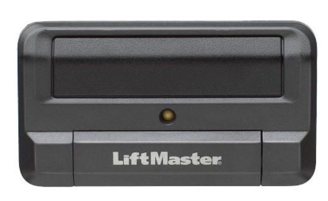 A black lift master remote control on a white background