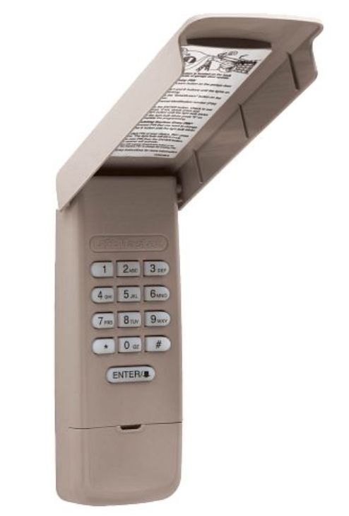 A brown remote control with a sticker that says ' enter ' on it