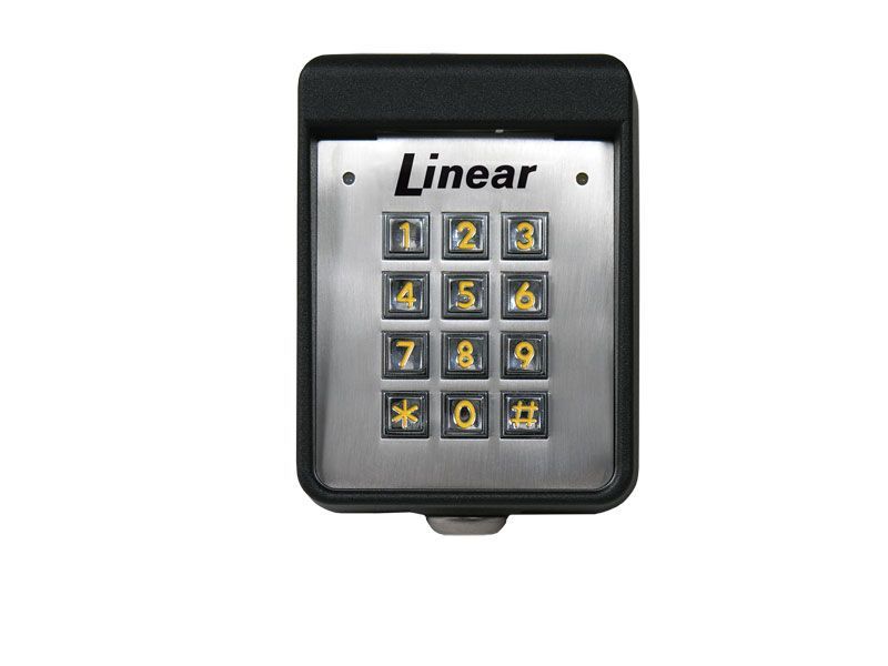 A silver and black keypad with the word linear on it