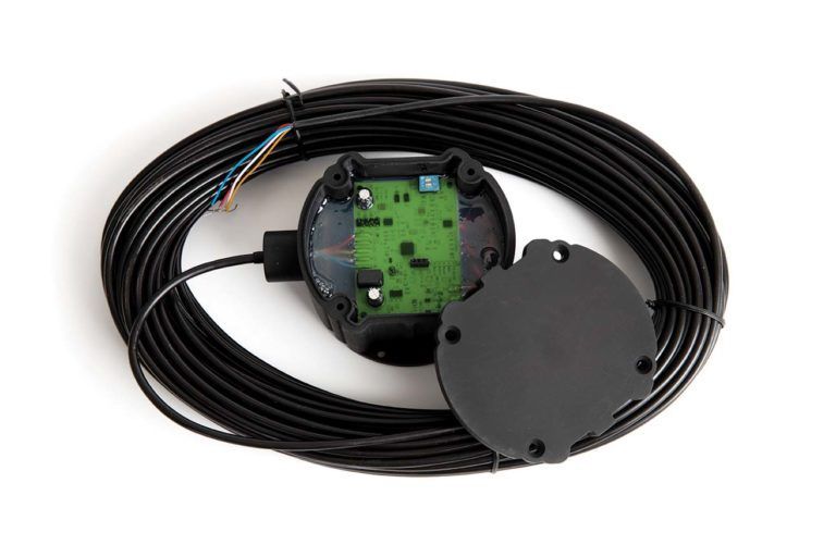 A close up of a black cable and a black device on a white background.