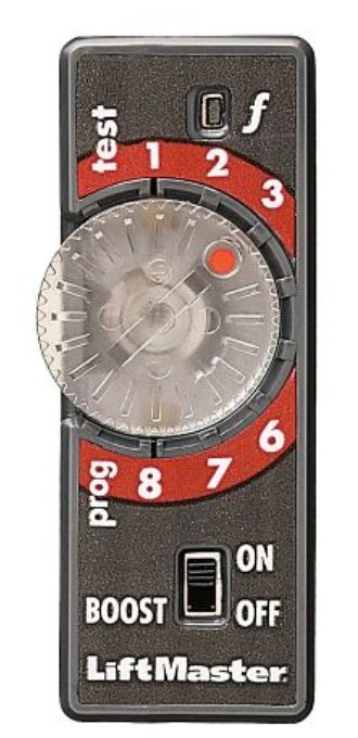 A close up of a lift master remote control