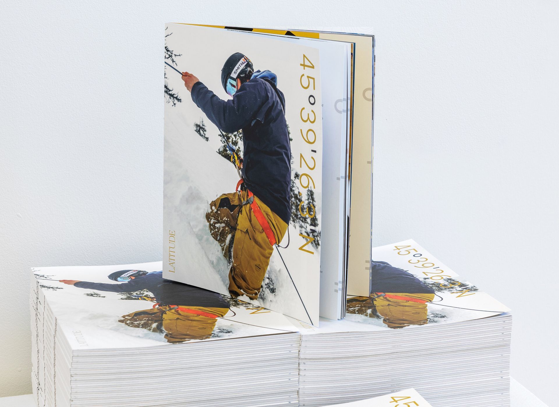 A stack of books with a picture of a snowboarder on the cover