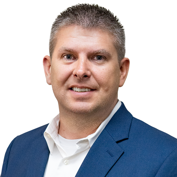 Portrait of a smiling professional in a blue blazer and white shirt on a white background