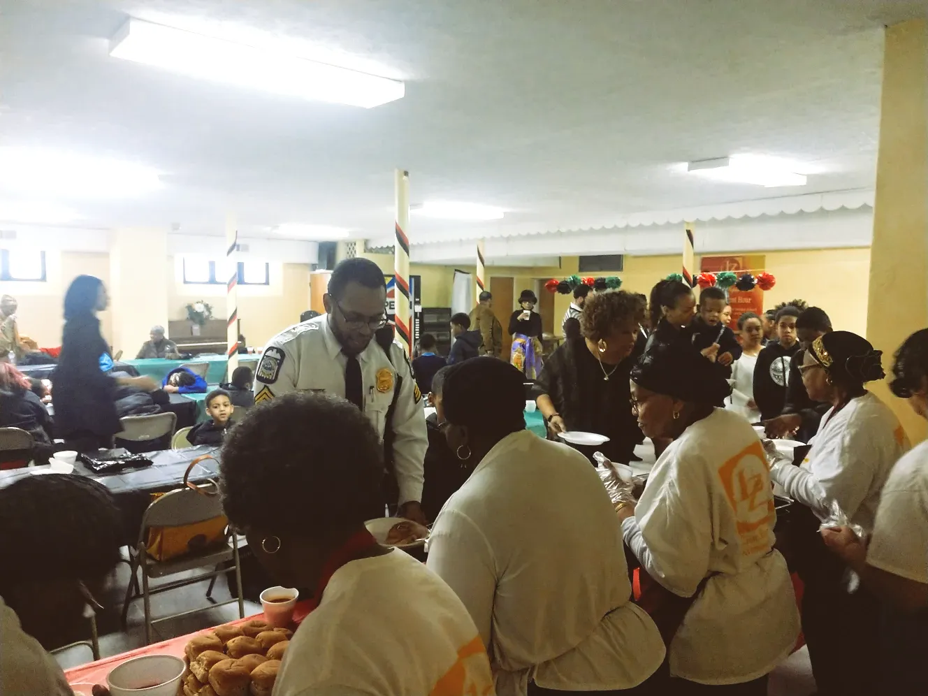 A group of people are gathered in a room.