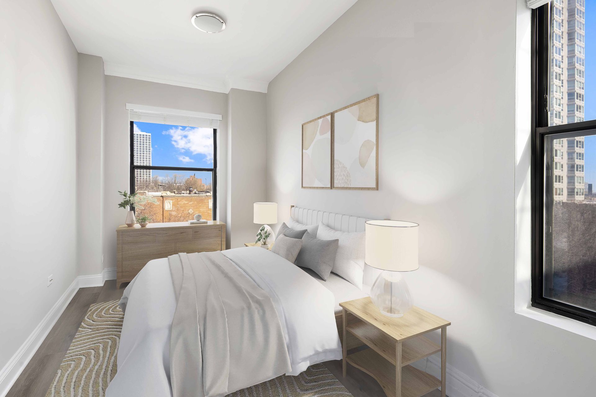 A bedroom with a bed, nightstand, and window.