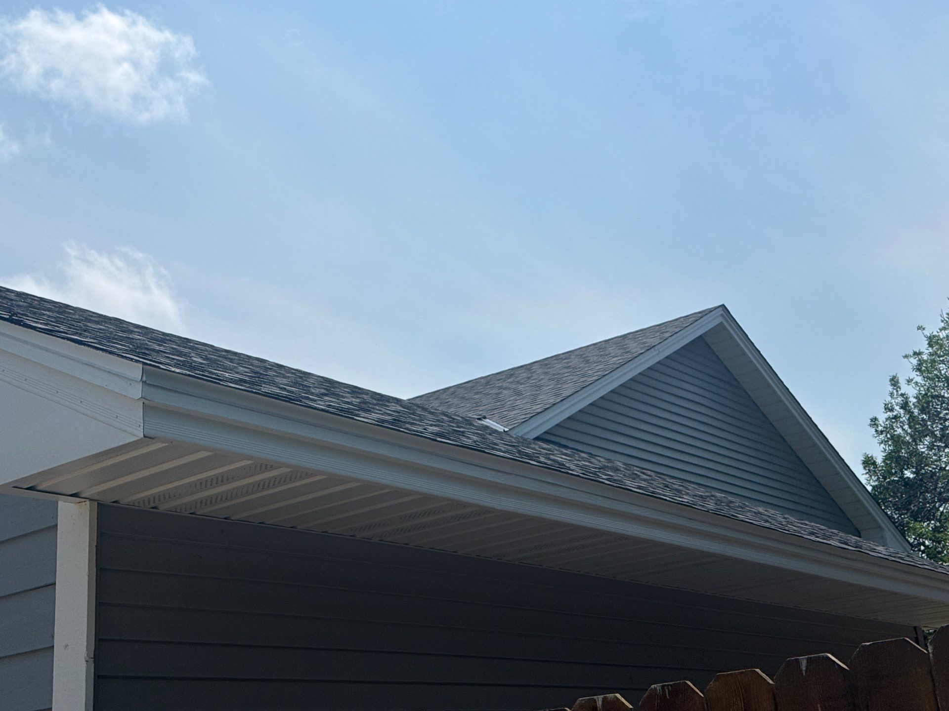 A home with new steel soffit, fascia, and gutters installed by ABC Seamless of Maple Grove.