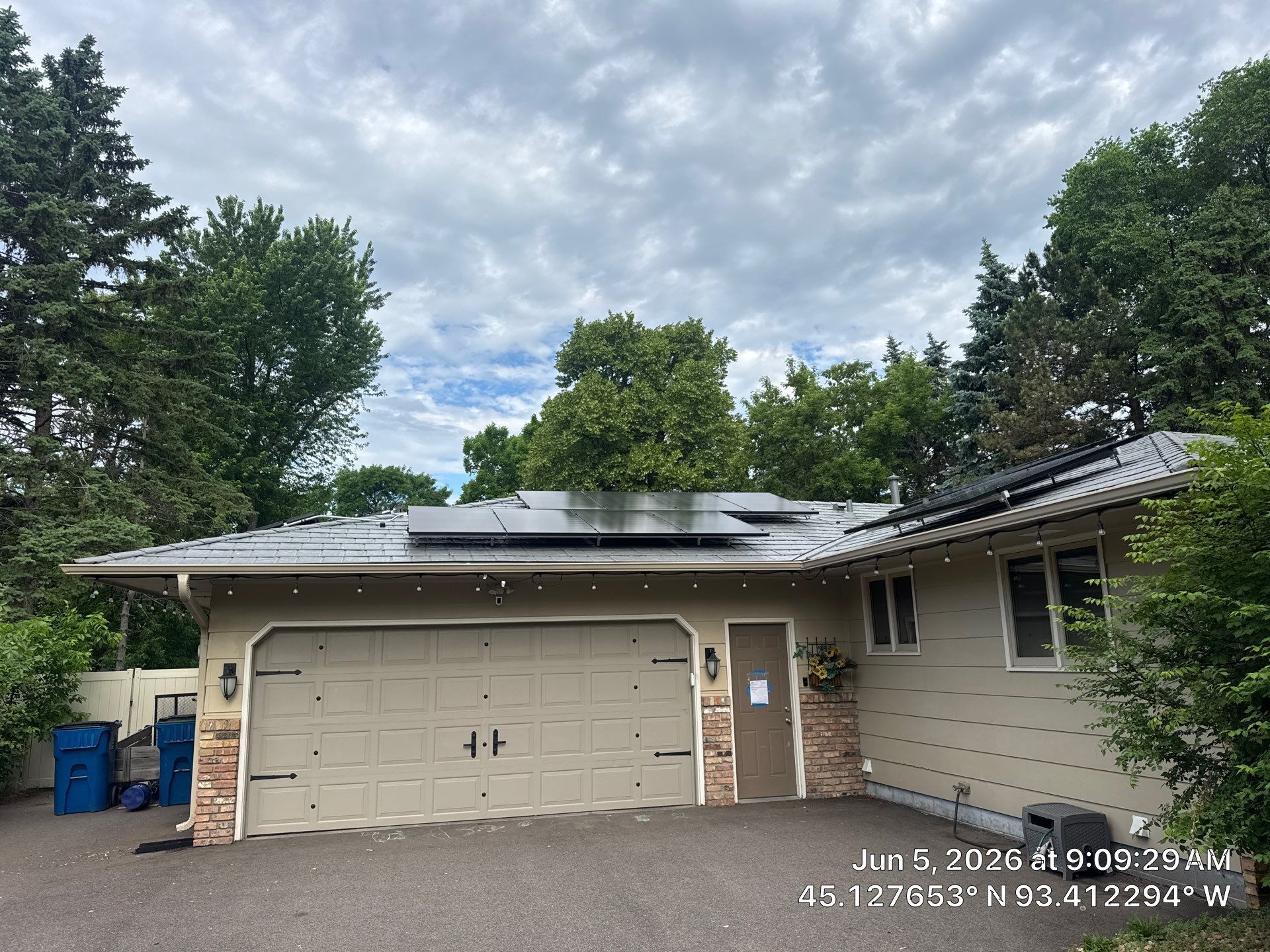 A Maple Grove home with a new steel slate roof and roof-mounted solar panels.