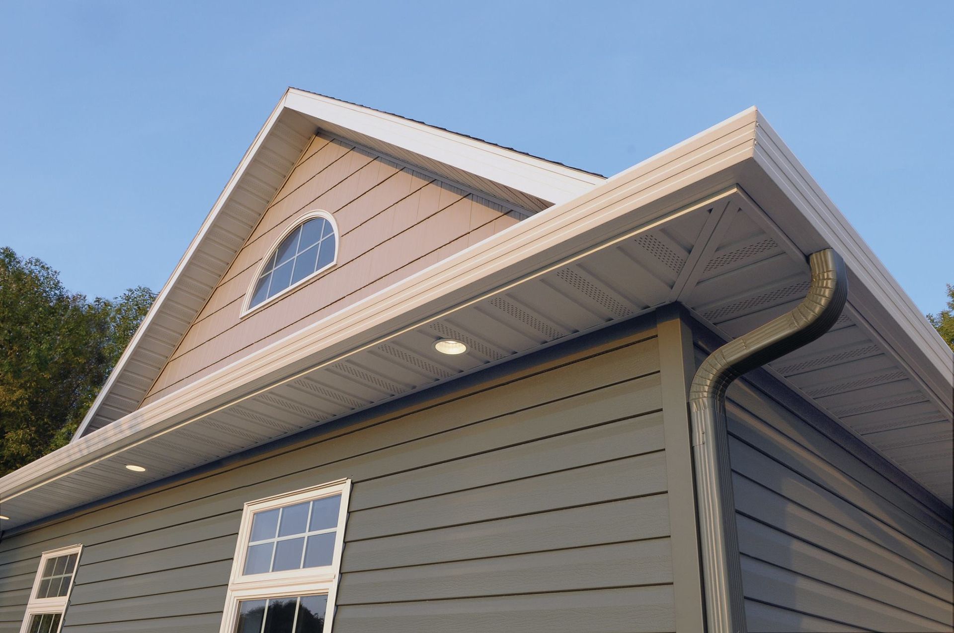 A house with a roof that has a window on it