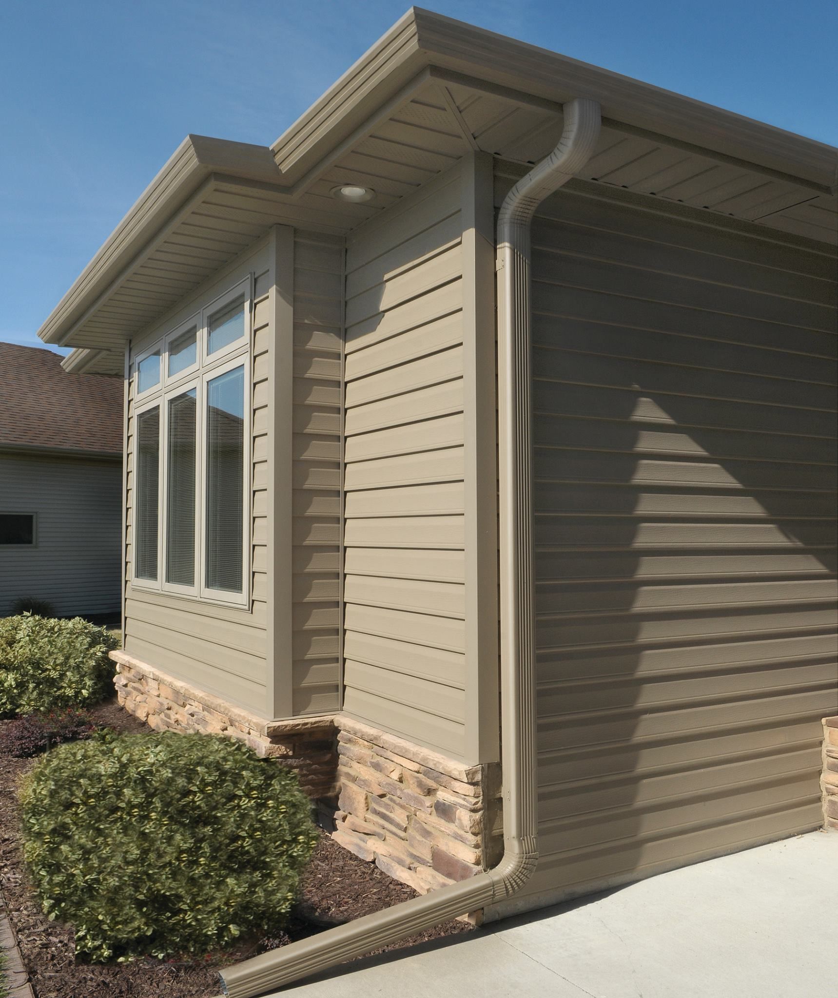A house with a gutter on the side of it