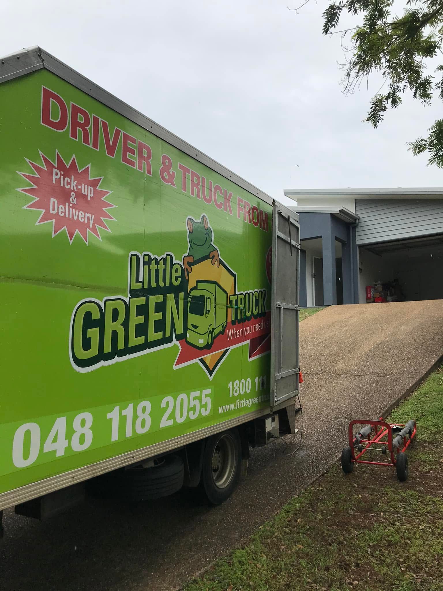 Green Little Green Truck Parked Beside a House on A Sloped Driveway, with A Red Blower Nearby — Little Green Truck Bundaberg in Toogoom, QLD
