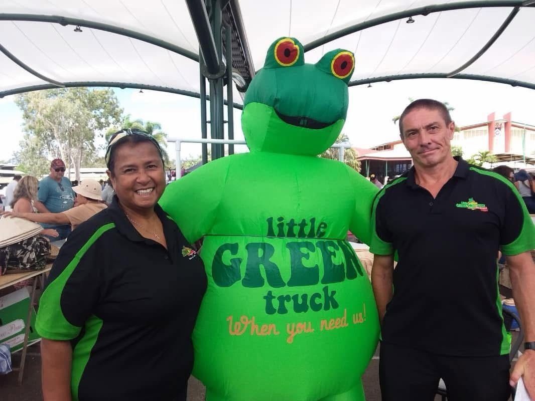 Two People Posing with A Large Green Frog Mascot Wearing a Little Green Truck Shirt — Little Green Truck Bundaberg in Burnett Heads, QLD