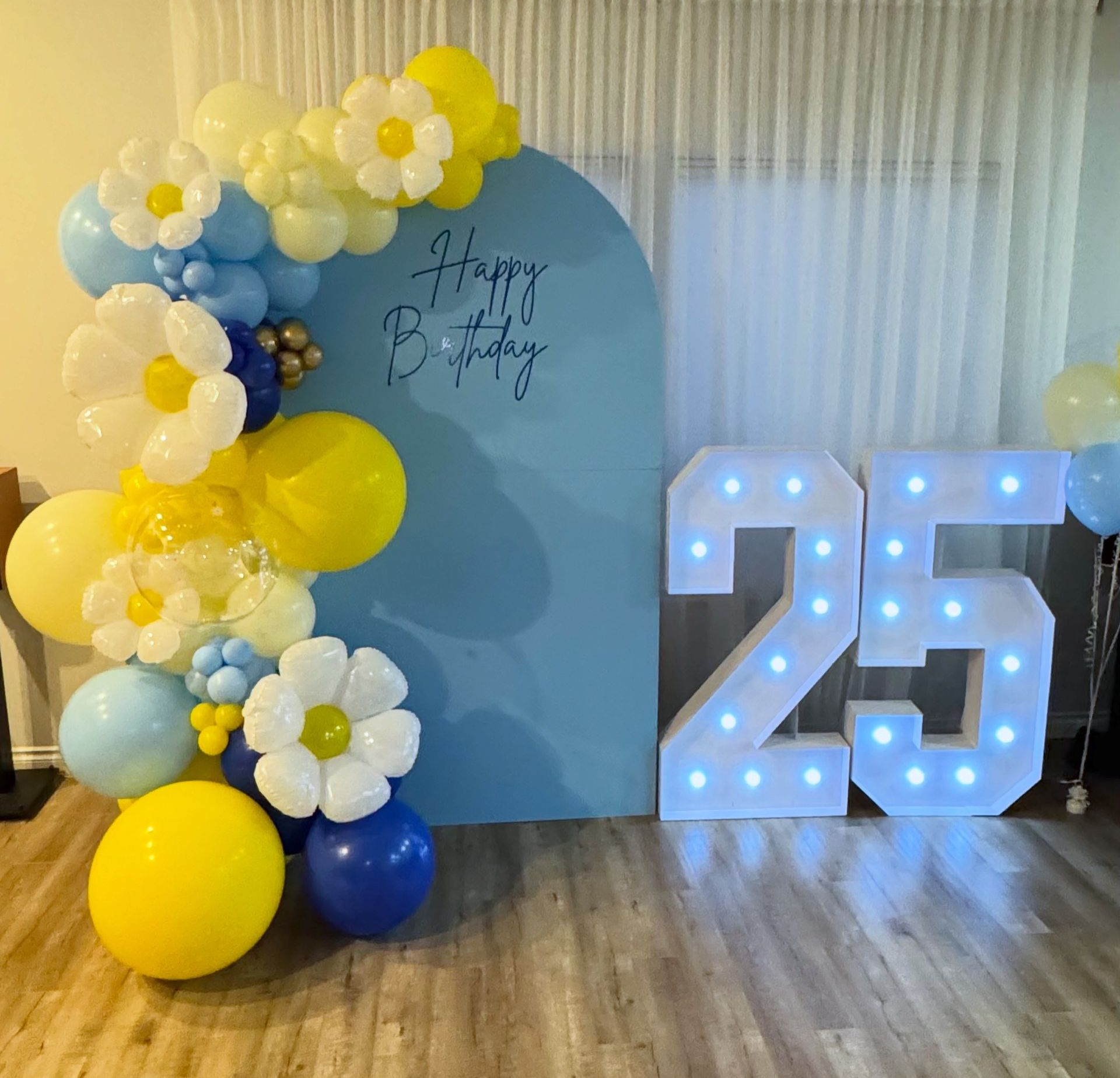 adult birthday celebration with balloons