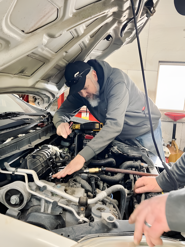 Mechanic works on a car engine | Yunker Motorwerx