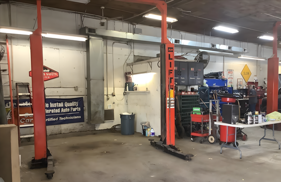  Yunker Motorwerx interior, with two red car lifts | Yunker Motorwerx