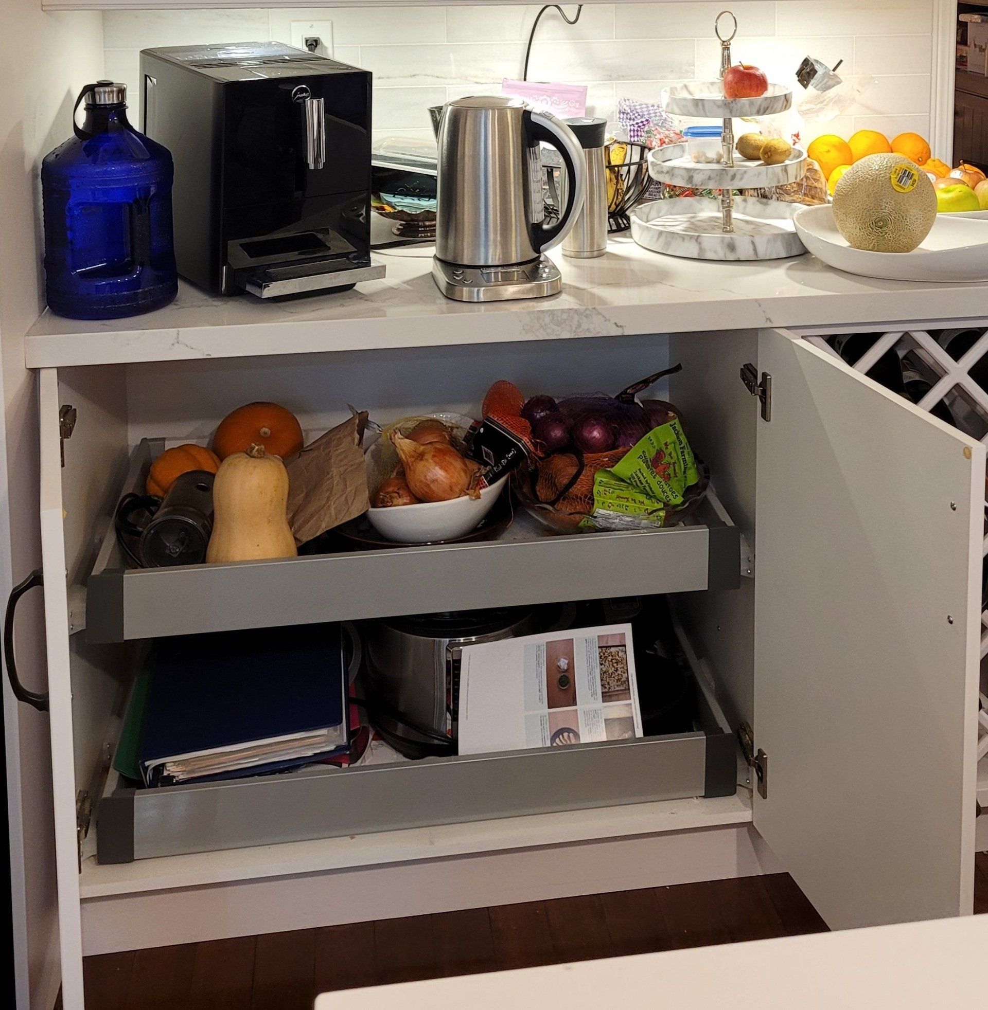 A kitchen with a shelf full of fruits and vegetables