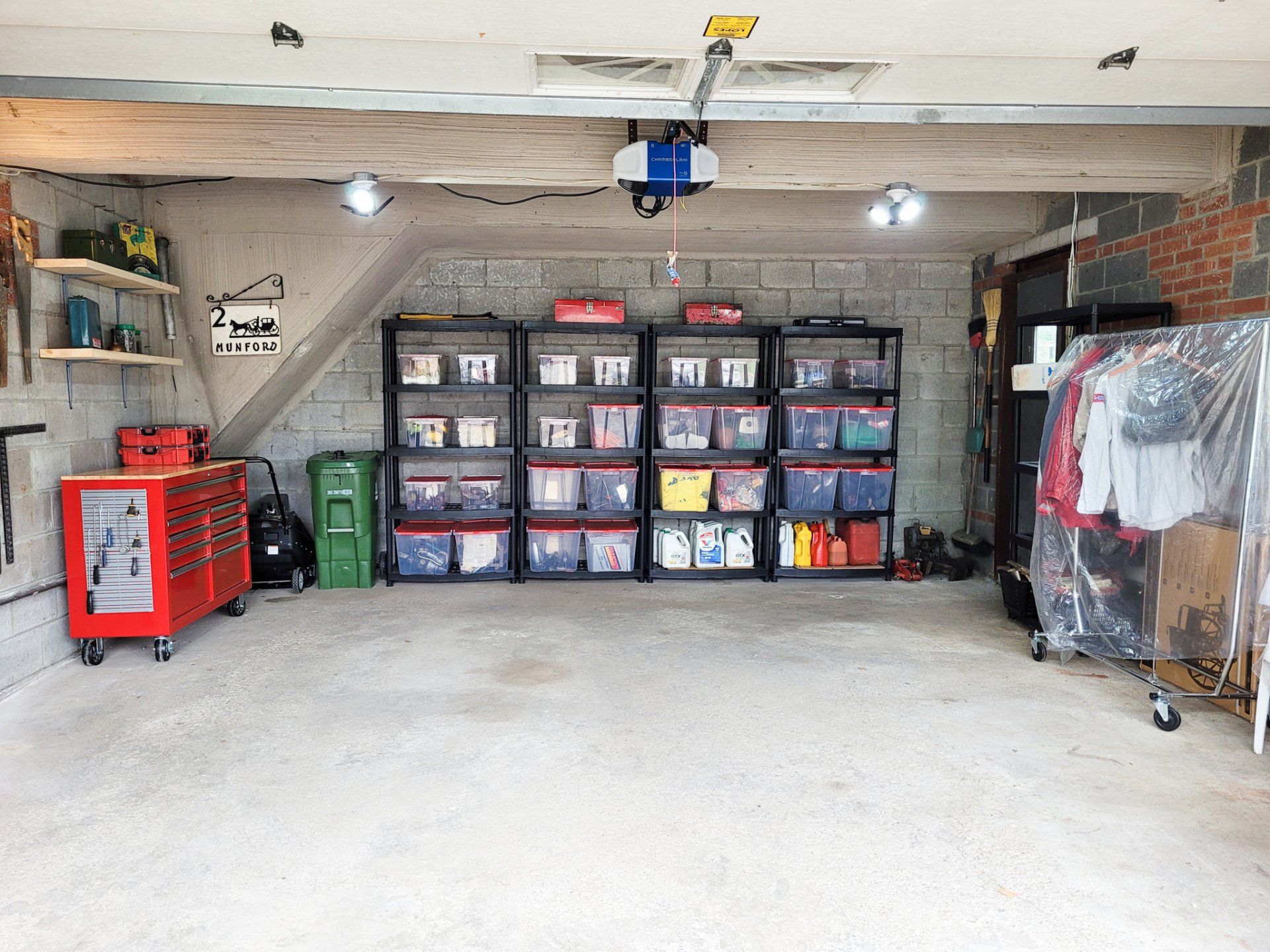 A garage filled with lots of storage containers and tools.