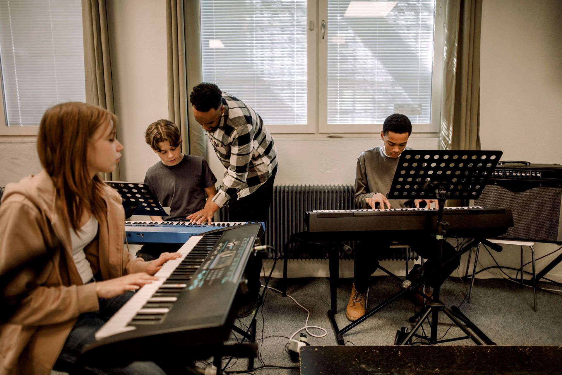 A Group Of People Are Playing Keyboards | Clayton, NC | Neighborhood Academy of Music