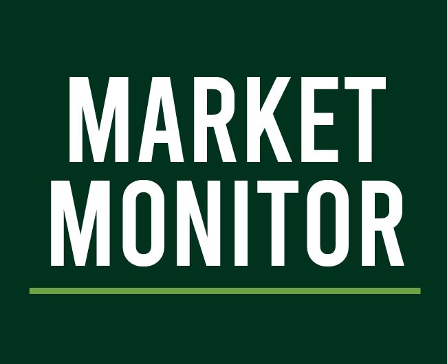 A green sign that says market monitor on it