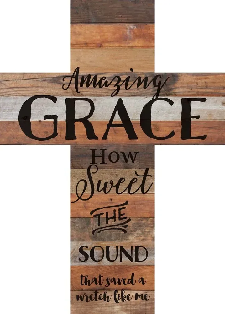 Rustic wooden cross with the words “Amazing Grace, how sweet the sound” in black lettering