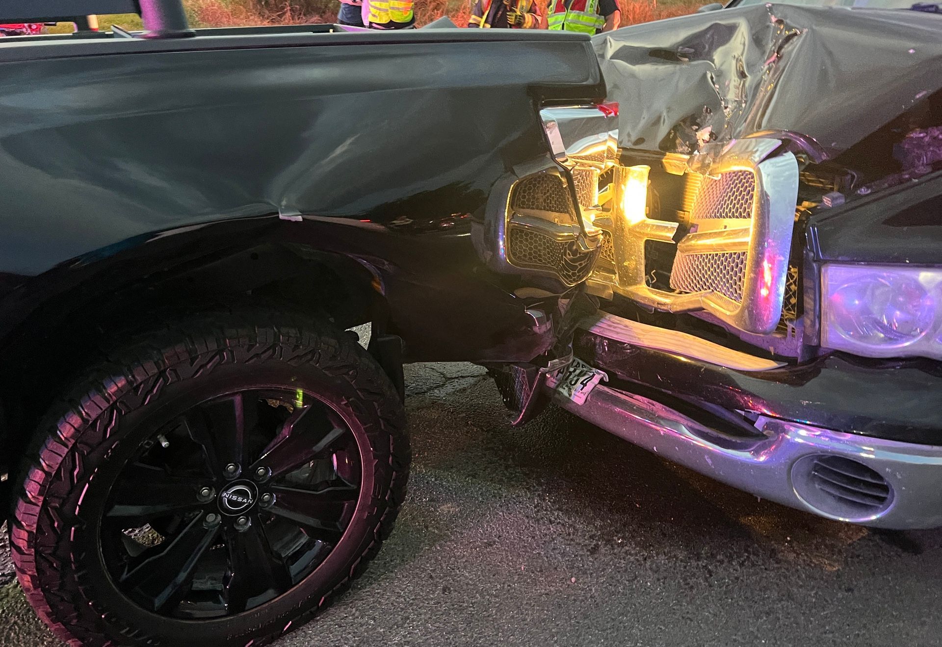 Close up of two crumpled vehicles caused by a rear-end collision at a red light in Denton, Texas.