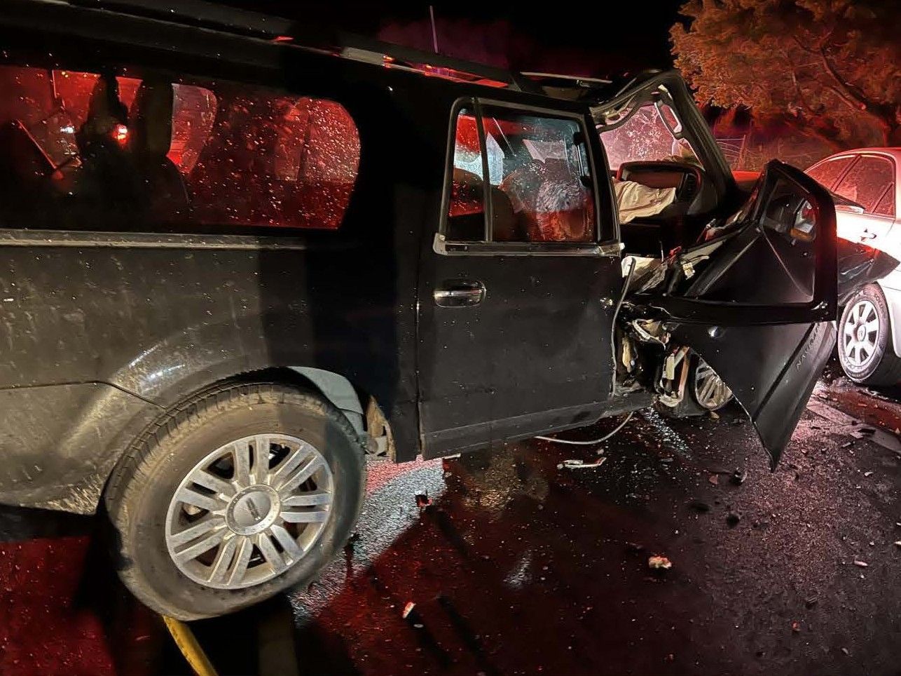 Close up of a heavily damaged SUV from a multi-vehicle accident that was caused by a wrong way driver.
