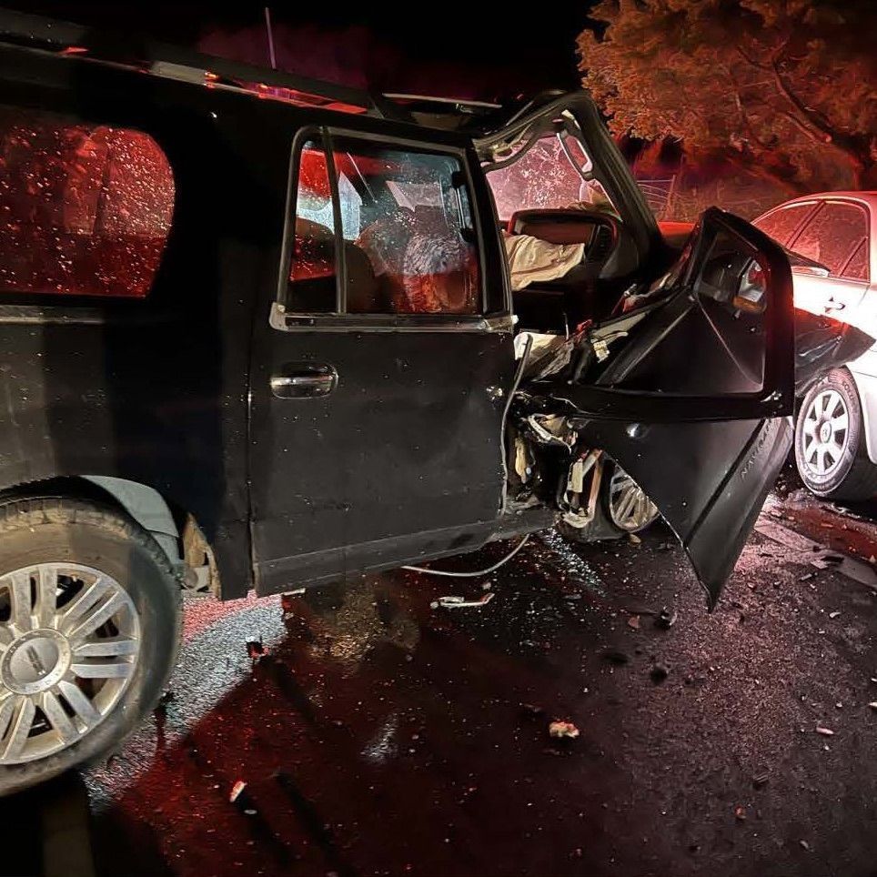 Close up of a heavily damaged SUV from a multi-vehicle accident that was caused by a wrong way driver.