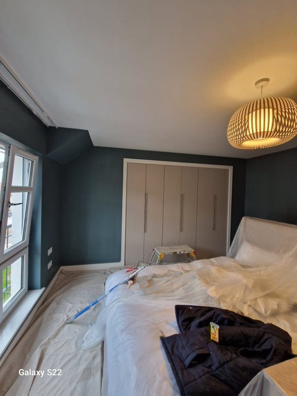 Elite Edge Painters and Decorators Manchester - Master Bedroom Painted Turquoise in a property at Ollerton Avenue