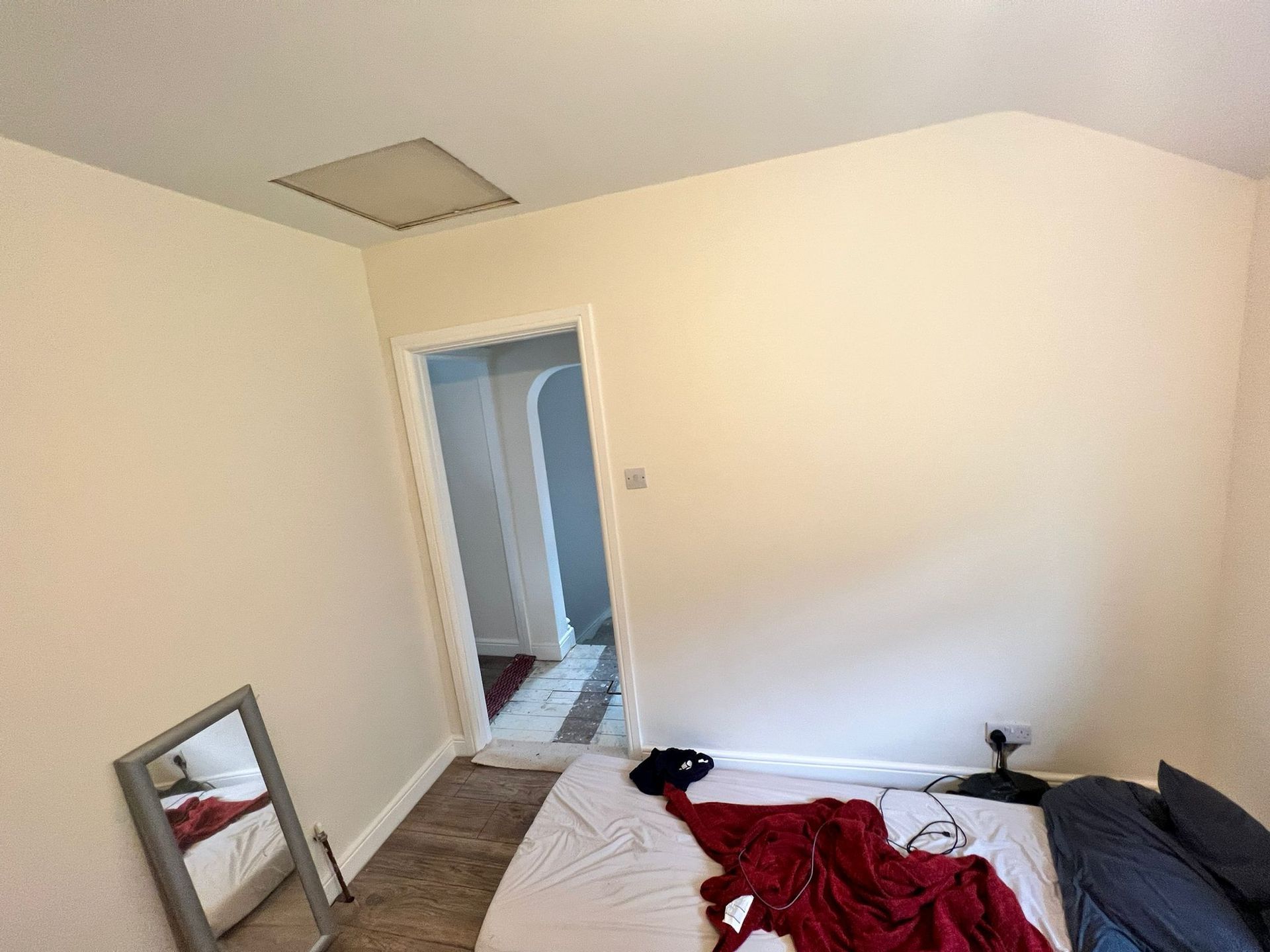 A picture of a bedroom painted white on Weir Street by Elite Edge Painters and Decorators Manchester