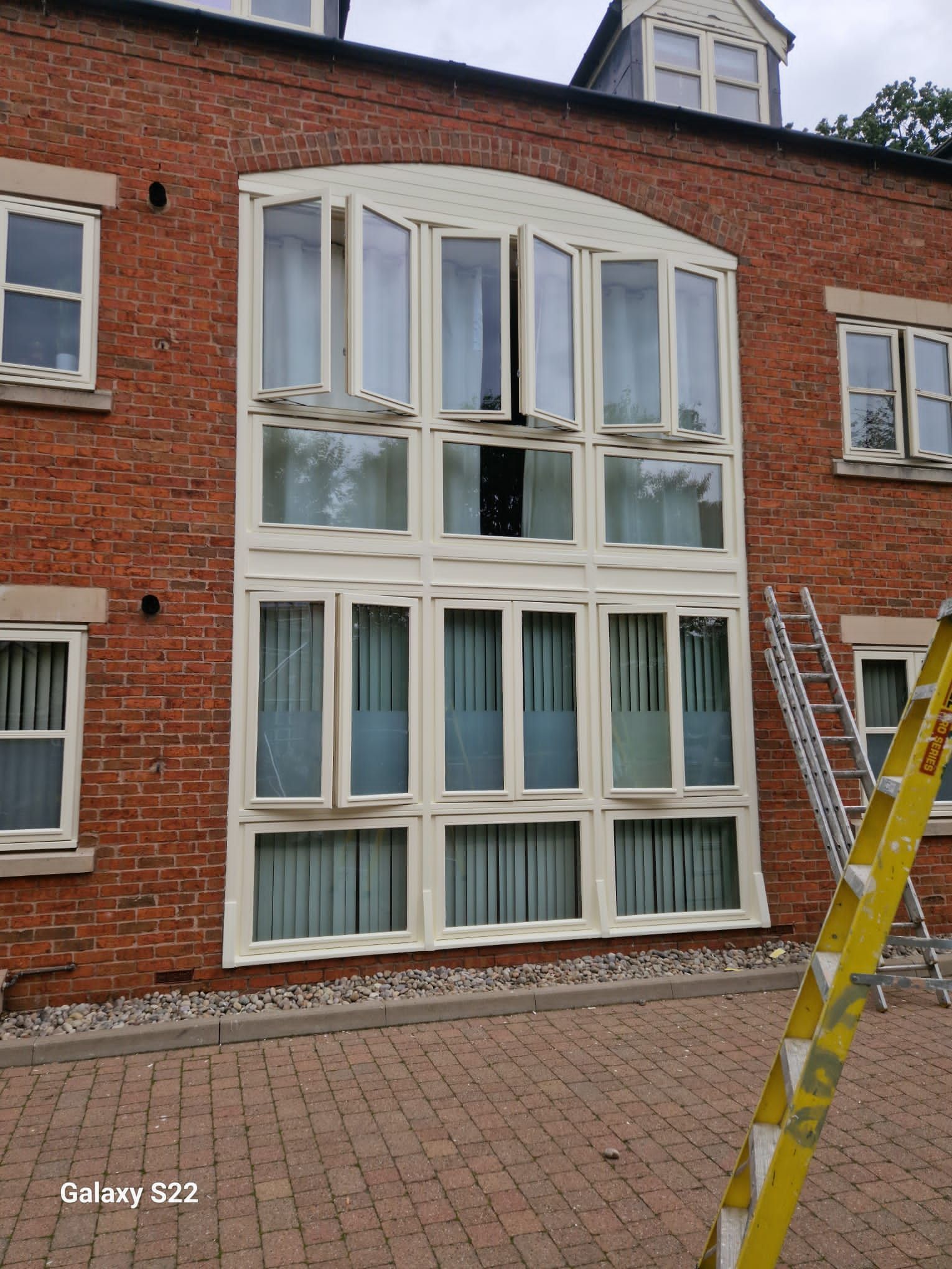 A picture of windows painted white on a property in Manchester by Elite Edge Painters and Decorators Manchester