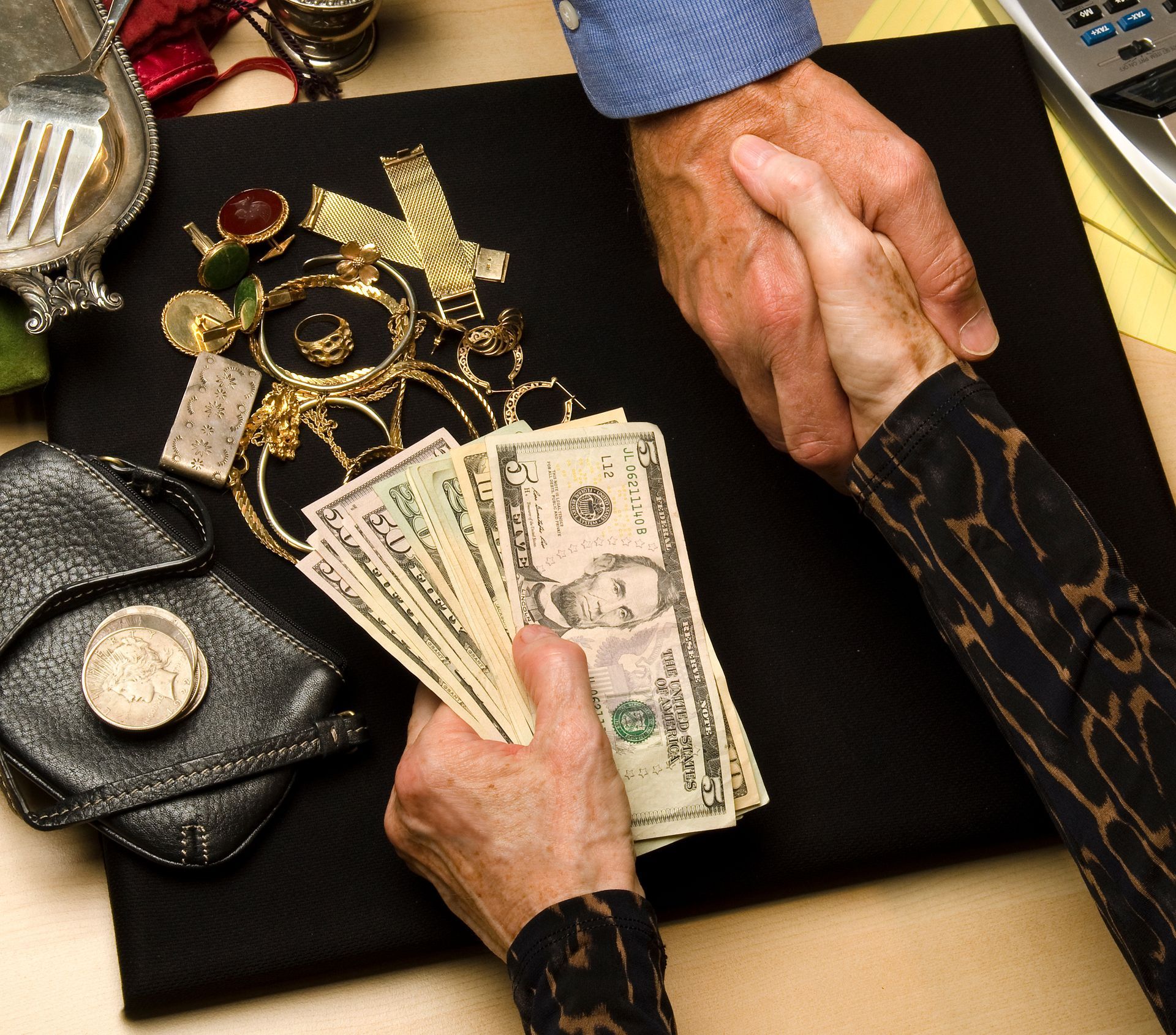 Cash for jewelry handshake.