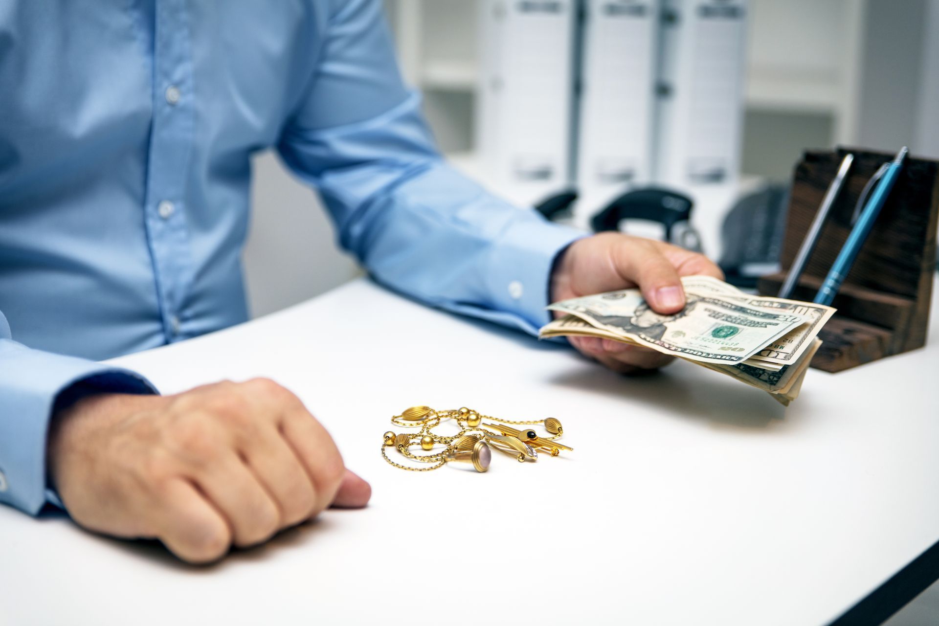 Trading jewelry for cash.