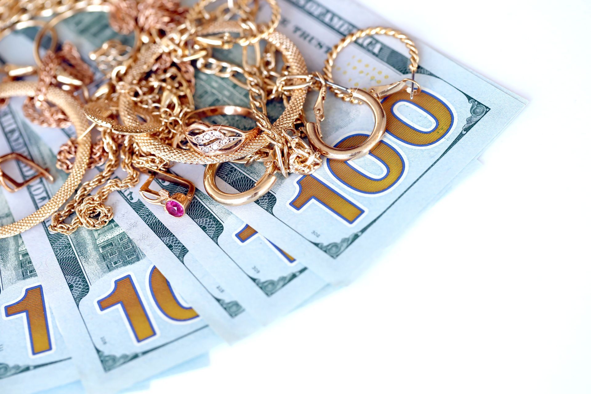 Gold jewelry on dollar bills. Gold jewelry on dollar bills.